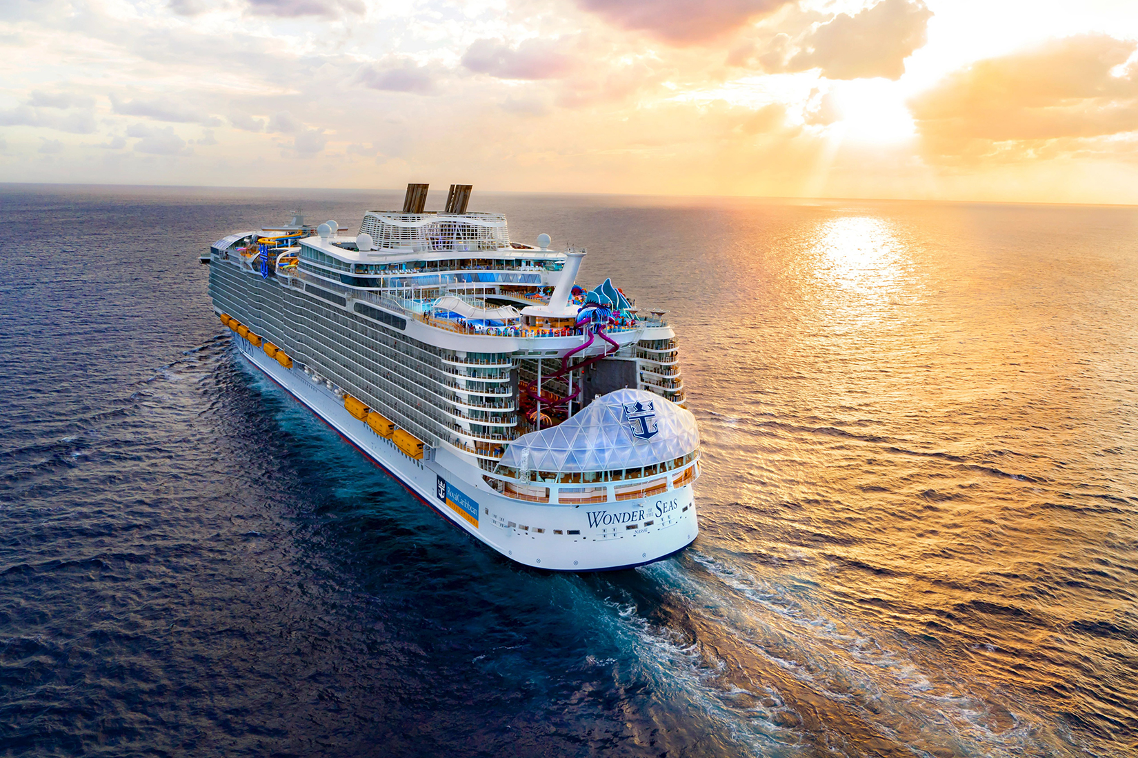 WN, Wonder of the Seas, Aerial, sunset, ocean horizon, oranges and purples, aft 3/4 view,